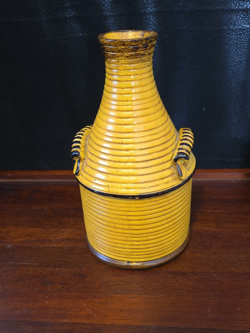 Kirklands Yellow Ribbed Resin Loop-Handled Vase